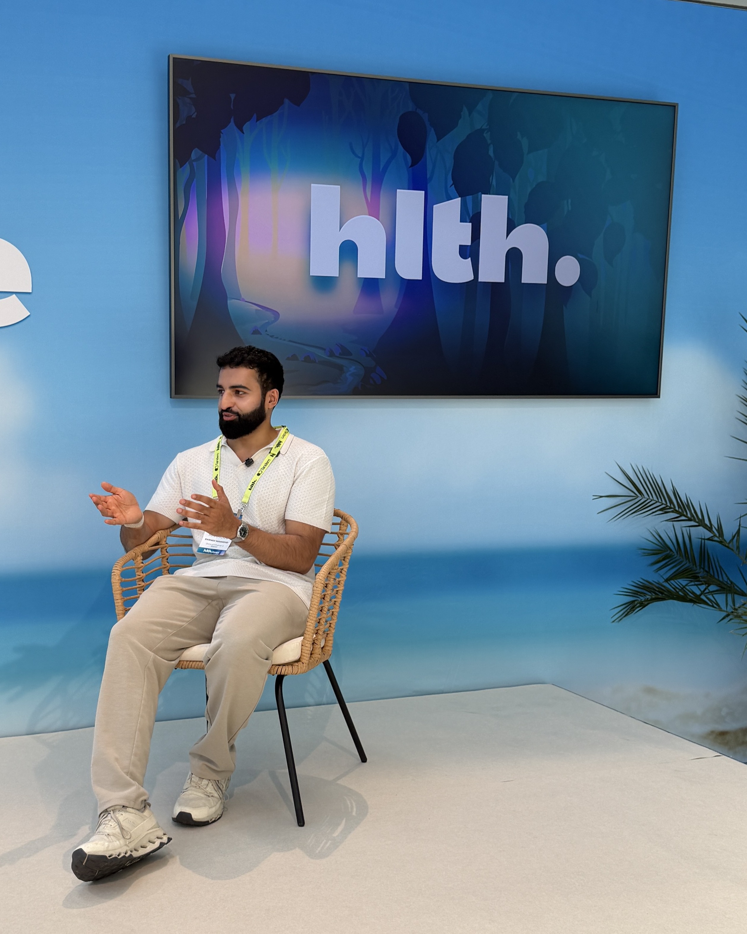 Dr Daanish speaking on stage at HLTH